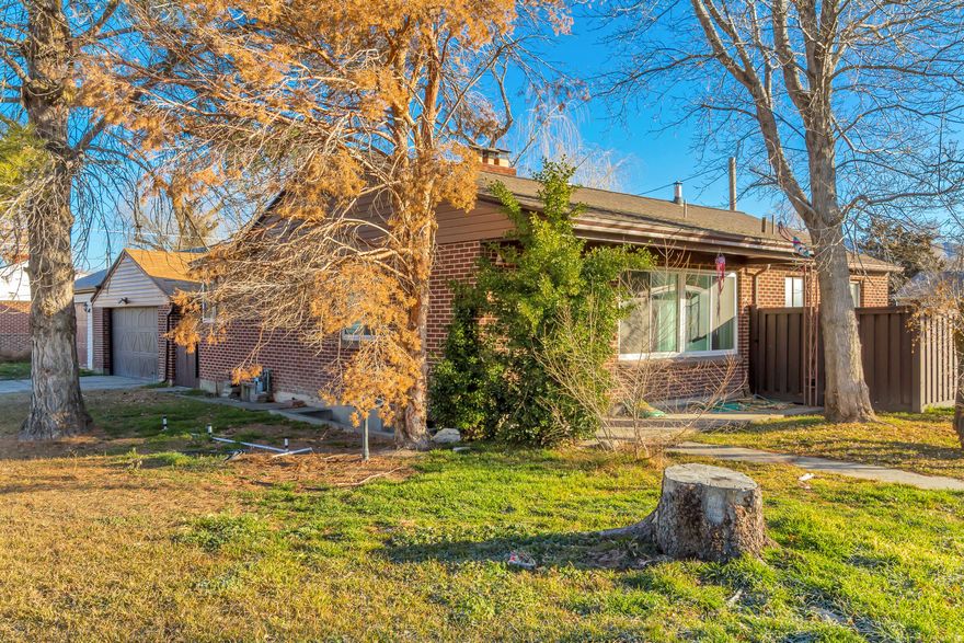 Nestled in a quiet, established neighborhood in the heart of South Salt Lake, this beautiful brick rambler offers the perfect blend of updated living and long-term versatility. Whether you are looking for a spacious primary residence or a property that can work for you, this home delivers. Freshly Remodeled Main Level Step inside to a main floor that has been recently remodeled, featuring a clean, contemporary aesthetic that highlights the home's classic architecture. Bright & Airy: Large windows flood the living spaces with natural light. Enjoy updated flooring, fresh paint, and stylish fixtures throughout the upstairs living area and bedrooms. Incredible Basement Potential. The lower level opens a world of possibilities. With its separate footprint and generous space, the basement is perfectly suited for a mother-in-law apartment. Situated on a spacious .29-acre lot, the property offers plenty of room for gardening, pets, or summer BBQs. The detached 4 car garage and brick exterior provide both convenience and timeless curb appeal. Located just minutes from the I-15 and I-80 corridors, you are perfectly positioned for a quick commute to Downtown Salt Lake City, the University of Utah, or the mountain canyons. You're also close to the growing commerce district of 3300 South, filled with local dining, cafes, and shops.
