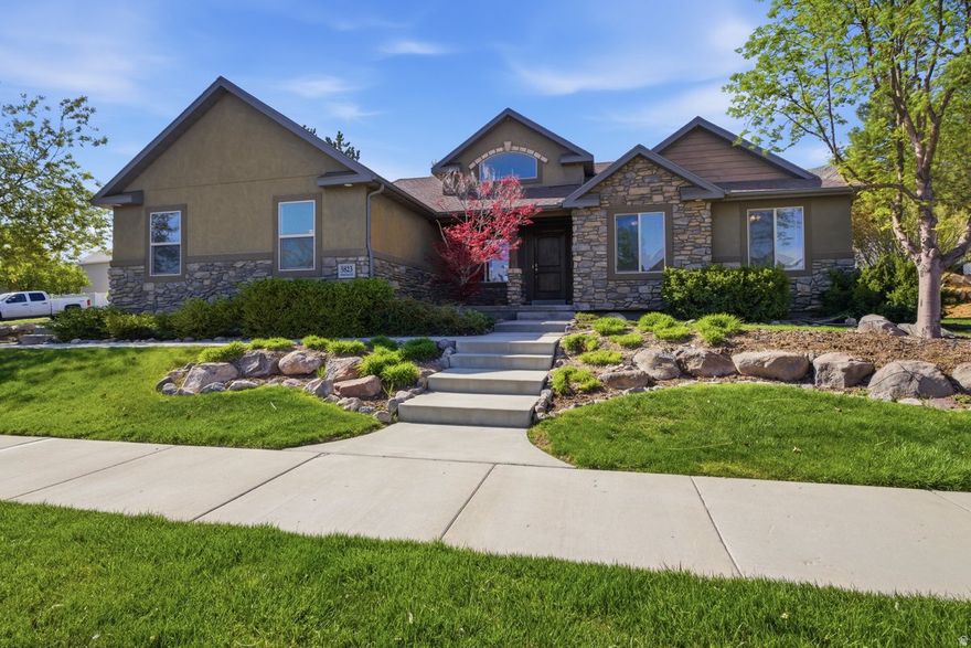 Tucked into the mountainside of Herriman, this beautifully maintained 5-bedroom, 4-bath home offers the perfect blend of comfort, space, and setting. From the moment you arrive, the thoughtfully designed landscaping sets the tone for what's inside.  Step into a warm and inviting main level featuring rich hardwood flooring and a cozy gas fireplace-perfect for gathering or unwinding at the end of the day. At the heart of the home, the spacious kitchen is designed to impress, offering granite countertops, a generous corner pantry, and abundant cabinetry for all your storage needs. Whether you're hosting a crowd or enjoying a quiet night in, this kitchen delivers both function and style.  Downstairs, the fully finished basement expands your living space with a large family room, two generously sized bedrooms, and a  bath complete with a beautifully tiled walk-in shower. A gas stove adds charm and warmth, making this space ideal for guests, entertaining, or multi-generational living.  Practicality meets convenience with a spacious 3-car garage and dedicated RV parking-plenty of room for all your vehicles, toys, and storage needs. Even better, all appliances are included, washer and dryer included, making this home truly move-in ready.  Located in a desirable neighborhood with a peaceful mountainside backdrop, this home delivers the space you need and the lifestyle you've been looking for.   Square footage figures are provided as a courtesy estimate only and were obtained from tax data.  Buyer is advised to obtain an independent measurement.