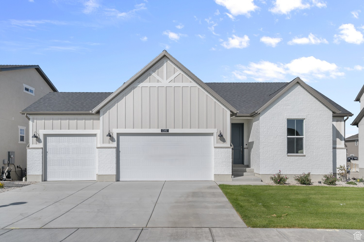 This inviting 1350 Farmhouse combines charm and comfort with smart design in a great community. Practical upgrades include a 3-car garage with keypad & exit door, 9-foot basement foundation walls with a walk-out door, can lighting, Christmas light outlets, a tankless water heater, and energy-efficient options throughout. The kitchen features white laminate cabinets, quartz countertops, stainless steel gas appliances, and a box window in the nook for added light and character. Flooring includes a balance of laminate hardwood, vinyl tile, and carpet, designed for durability and style. Inside, timeless touches shine with Craftsman base & casing, cultured marble shower surrounds in the owner's suite, and satin & brushed nickel hardware. The box window in the owner's bedroom enhances natural light and creates a cozy retreat. Comes fully landscaped and maintained by the HOA for hassle free listing. This home offers the perfect blend of modern convenience and farmhouse charm! Come check it out today!
