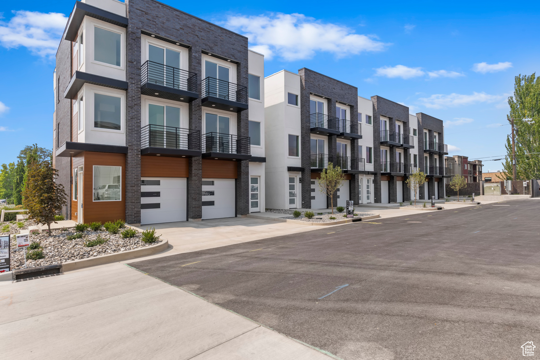 Welcome to the modern and stylish urban townhomes located on historic Main Street in Bountiful, designed to offer a contemporary and convenient living experience. Enjoy the spacious and open feel provided by the 9 ceilings throughout the home. The kitchen features sleek white cabinets, enhancing the modern aesthetic and providing ample storage space. Every aspect of these townhomes has been carefully curated to reflect a contemporary design. Situated in a prime location, residents have walking access to various fun shops and dining options. High-quality roller shades are installed on all windows, allowing for easy light control and privacy. Enjoy the breathtaking views and plenty of natural light thanks to the generously sized windows in every room. The two-car garage is not only spacious but also finished with a high-quality paint job.