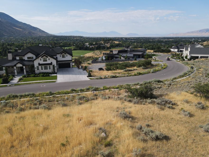 Enjoy breathtaking views with this premium lot in Heritage Hills. Property backs up to beautiful open space with trails. No HOA. Bring your own custom home builder and build your dream home. Backs up to 36 plus acres of dedicated contiguous CITY OPEN SPACE, (Plats, A,B,C& F) and has direct access to the adjacent City OPEN SPACE property to the North, possibly to the public lands above. Verify with Alpine City current published Trail Map System Alpine City has information and maps of their trail system at City Offices.