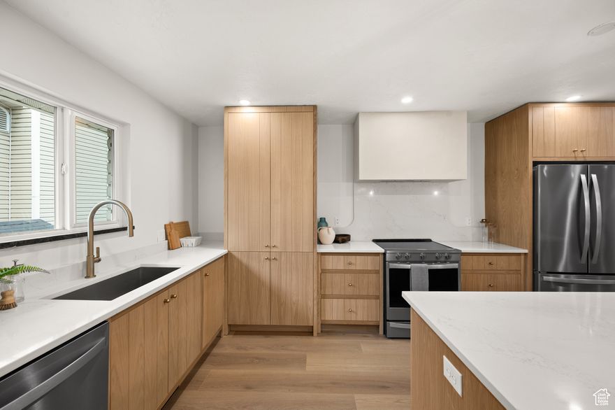 We're Curious... What price would be a win for you on this property? Click the link below to submit your answer.  https://docs.google.com/forms/d/e/1FAIpQLSe0TtprNG65r_5mAWne_tXtvK2J0ppeTBjeOwJpfMQ-mnyHaw/viewform?usp=header  Stunning Sandy Remodel with Custom White Oak Kitchen & Basement Apartment! Located near Quail Hollow Park with quick access to both Big & Little Cottonwood Canyons and Fort Union shopping, this home delivers on location and luxury. Inside you'll find a custom white oak kitchen with high-end appliances, quartz counters, and sleek cabinetry, opening to a spacious great room perfect for dining and entertaining. The primary suite is a true retreat with a spa-inspired bath, walk-in closet, and convenient in-suite laundry. Downstairs, the fully renovated basement apartment adds flexibility for multigenerational living, guests, or rental income. Every detail showcases quality craftsmanship, with new white oak flooring, custom cabinets & vanities, tiled baths, designer lighting, and plush new carpet throughout. A thoughtful layout, modern finishes, and high-end upgrades make this home a rare Sandy find.