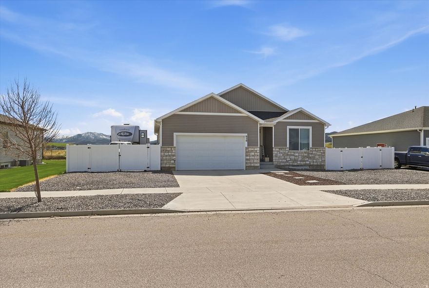 This pristine 4-year-old home in Hyrum's desirable Rolling Hills Subdivision offers 3,100 square feet of thoughtfully designed living space, including a massive unfinished basement ready for your personal touch. Situated on a manageable .28-acre lot, the property is a dream for those seeking a low-maintenance lifestyle thanks to professional xeriscape landscaping and dedicated RV parking for all your mountain toys. The interior shines with modern finishes and a "move-in ready" perk: the sellers are including a full suite of kitchen appliances-including the gas oven, refrigerator, microwave, and dishwasher-all purchased brand new with the home. With its spacious 3-bedroom, 2-bathroom layout and unbeatable location near Hyrum Dam, this property combines modern convenience with the room to grow you've been looking for. The city owns the retention pond behind the property, which promises privacy from backdoor neighbors!  Square footage figures are provided as a courtesy estimate only. Buyer is advised to obtain an independent measurement.