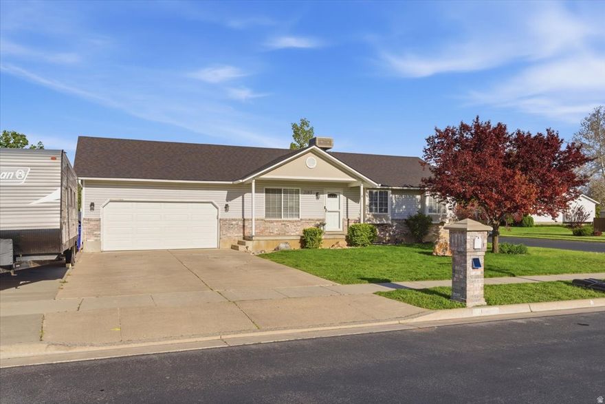 Cute rambler in a great location! Home has been updated throughout. Newer roof. Brand new water heater. Updated kitchen with stainless steel appliances, granite counters, tile backsplash, and new cabinets. Spacious bedrooms. Updated bathrooms with tile and cultured marble surround showers. New lighting fixtures. Cold storage. Situated on a corner lot, large fully fenced yard with a patio for entertaining, mature trees, and RV parking. Home is just minutes from a golf course, schools, parks, and easy access to the West Corridor Highway. Sq. footage per tax data records. Property facts provided as a courtesy; Buyer to verify all information.