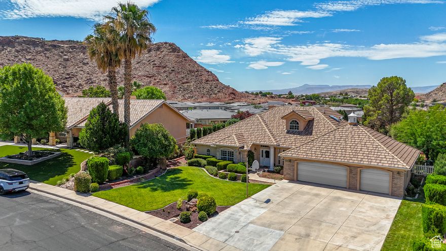 Nestled in an upscale, beautifully maintained neighborhood, this spacious 6-bedroom home with an office/den offers the perfect layout for multigenerational living. Enjoy two primary suites, one with a walk-in tub, and four full bathrooms throughout. The recently updated kitchen and living room create an inviting open-concept space ideal for family gatherings. Situated on a large lot with mature trees and meticulously cared-for landscaping, the home boasts curb appeal and tranquility. An oversized 3-car garage provides ample storage. Centrally located in St. George, you're just minutes from shopping, dining, and everyday conveniences. A rare find combining comfort, style, and location!