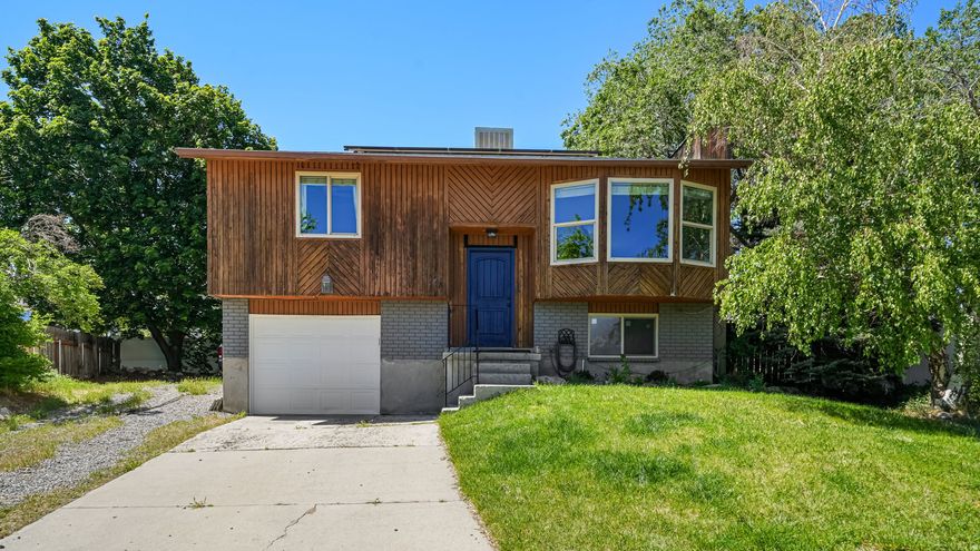 Single family home in SLC for less than $430k! Gorgeous cul-de-sac location on a hill with unobstructed views of the Cottonwoods. New carpet, fresh paint, and a remodeled bath are highlights that make this home move-in ready. Roomy kitchen with gas range, ample counter space with breakfast bar, and updated appliances. Furnace, A/C, and water heater all replaced within 5 years. Oversized attached garage. Out back: a large new deck, fire pit area, storage shed, extra parking, and a fully fenced yard built for entertaining.