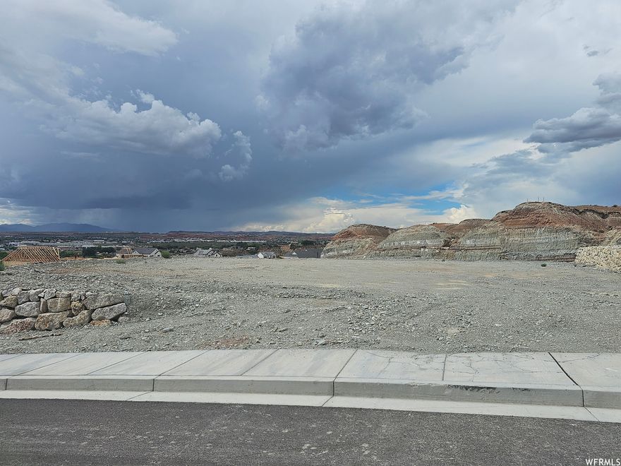 THIS LOT IS A MUST SEE! Large 0.56 acre building view lot with incredible mountain views and city lights. Build your dream home on this lot in the last phase of the prestigious Indian Knolls development. Only 9 lots left. Bring your own builder on these graded, pad ready to build lots. You'll fall in love with this neighborhood that sits above Washington Fields, yet minutes to town, schools, parks and shopping. A high-end custom home subdivision with low utility costs on Dixie Power. All engineering finished with great soils.