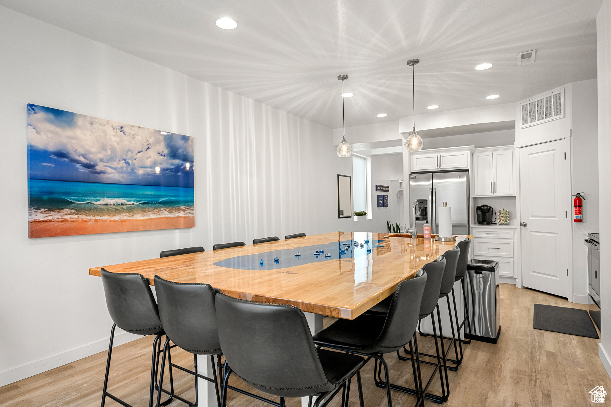 This charming end-unit townhome, within walking distance from the marina, grocery store, and local restaurants. Fully furnished, it's standout feature is the custom-built Bear Lake table, a welcoming centerpiece that sets this home apart from others in the subdivision. There is boat parking and is approved for short-term rentals. The home is has a security system and cameras that can be operated from your cell phone, giving great peace of mind when you are far away.