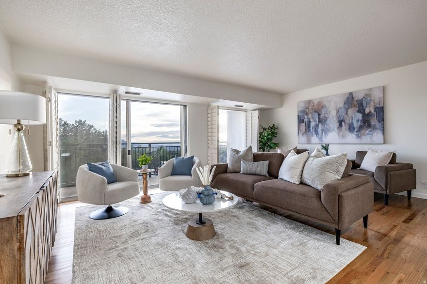 Situated at the mouth of Emigration Canyon in the St. Mary's neighborhood, this Canyon Crest condo offers beautiful views of the Salt Lake Valley all the way to the Oquirrh Mountains. Located on the third floor, this two-bedroom, two-bathroom residence features renovations throughout the condo, including a new kitchen in 2019 and new bathrooms in 2009. The recently renovated kitchen was opened to the living and dining rooms, with all new appliances and custom-built maple cabinetry and quartz countertops. The renovated main bathroom has a tiled shower with a bamboo wood floor, while the primary bath includes a custom-tiled shower and bathroom floor. Both bathrooms have new vanities and sinks (double in main) with travertine counter tops. Other than the bathrooms, the entire condo had oak hardwood flooring installed in all rooms, along with new paint throughout. A large private deck provides space to relax and take in the scenery. Each bedroom enjoys valley views as well.. The home is set within a secure, controlled-access building with a welcoming lobby and on-site management and support staff. HOA amenities include a pool, lawn area, gas grills, picnic space, exercise room, self-service car wash, and ample guest parking. Trash, water, sewer, insurance, gas, and electricity are all included in the HOA fee. The condo has been set up for Google Fiber. The unit also has two assigned parking spaces in a heated, underground garage. A large above-floor storage cabinet is immediately adjacent to each parking space (A and B floors), and a double-size private storage room with electrical power is also available on the A-level parking floor. The Canyon Crest Condominiums is a short distance to Donner Trail Park; it is also ideally located near the University of Utah and its Health Sciences Center, including University Hospital and Research Park. The condo is also near other major hospitals, Hogle Zoo, This is the Place Heritage Park, Bonneville Golf Course, and Coach Mike's Tennis Center. The condo has easy access to hiking and biking trails including the Bonneville Shoreline Trail, a quick drive downtown Salt Lake City and to the Salt Lake International Airport.