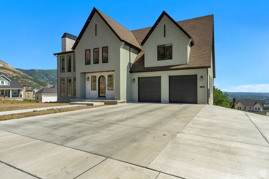***HUGE PRICE IMPROVEMENT!!!*** Welcome to the perfect family retreat! This custom built estate offers the ideal blend of comfort and functionality with luxury upgrades throughout. With generous living areas, an open floor plan, and large windows that flood the space with natural light, every room feels bright and inviting. Thoughtfully designed with family living in mind, this home boasts breathtaking valley views from the back deck, gorgeous custom designed kitchen with high end appliances, fixtures, lighting, custom cabinet finishes and even smart blinds in the primary suite, office and living room.   Incredible master bedroom and bath that boast vaulted ceilings, custom finishes, european glass shower, custom soaker tub, smart toilet and huge walk in closet, perfect for any wardrobe.  Needing that perfect space for a family member or visitors? Enjoy the custom finished basement, complete with gorgeous fully equipped kitchen, all appliances, separate laundry, incredible lighting, completely wired surround sound with 11 speakers and completely private entrance with separate parking.  Let's not forget the perfectly designed recreation room, ready for your indoor basketball court, indoor soccer practice, climbing wall or kids play area.  Complete with full RV parking areas equipped with 50 amp service, hot / cold water and sewage service; this gem is ready for your landscaping finishes.  This home is one of a kind, you will love it.