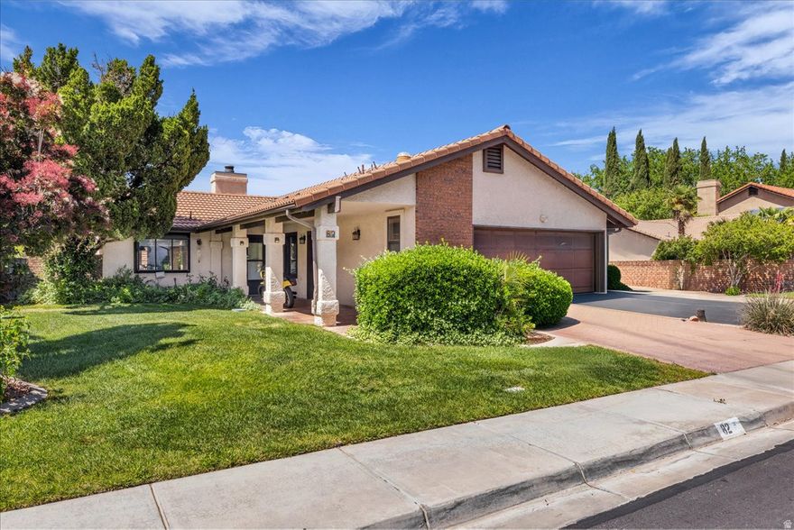 Gorgeous updated home nestled in a charming neighborhood with mature trees and lush green space. An inviting covered walkway welcomes you to the front door, setting the tone for this well cared for home.  New hard-surface flooring, fresh three-tone paint, and upscale appliances, including the refrigerator create a wonderful ambiance.  A functional floor plan with open concept kitchen and living area boasts a lengthy kitchen bar/island that seats many.  Ample storage in this home with built-in shelving in primary bedroom and built in cabinets in garage. Newer light fixtures and 3 ceiling fans add appeal and comfort. Thoughtfully designed rear yard with easy care turf, lush greenery, flowering shrubs and a large pergola to unwind.  Convenient location with wonderful resort style HOA amenities.  Buyer and buyer's agent to verify all.