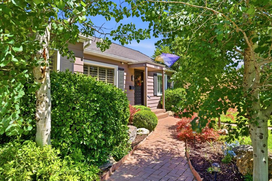 Tucked into one of Murray's most beloved neighborhoods, where neighbors gather for frequent parties and lifelong friendships are built, this enchanting bungalow cottage on Rainbow Drive offers something increasingly rare - a home that feels like a private escape from the outside world. Set on an extraordinary .44-acre lot, the grounds are nothing short of magical. Towering mature trees, including a large apple  and pear tree,  lush landscaping, blooming irises, roses, and seasonal florals create layers of color and beauty throughout the seasons. Massive floor-to-ceiling windows frame the backyard like living artwork, filling the home with natural light and peaceful garden views. Warm, bright, and thoughtfully designed, the home offers an inviting layout ideal for both entertaining and quiet everyday living. The primary suite is privately positioned on its own side of the home, separated from the additional bedrooms to create a peaceful retreat within the house itself.   But it's the backyard that truly transforms the property into something unforgettable.   Just off the home, a spacious deck overlooks the stunning grounds below, while a second sitting area centered around a wood-burning fireplace creates the perfect atmosphere for cozy evenings under the stars. Further into the yard, a tucked away platform offers an ideal setting for yoga, meditation, morning coffee, or simply unwinding beneath the trees.   And then comes the surprise few expect.   An ivy-covered fence appears to mark the end of the yard... until it quietly opens into a hidden secret garden beyond. Around the corner awaits an expansive additional garden space complete with a storage shed, children's swing set, and endless room for vegetables, flowers, herbs, and fruit. Whether you dream of creating a thriving garden-to-table lifestyle, expanding outdoor entertaining spaces, or simply enjoying your own private park-like setting, the possibilities here feel endless. The additional land also opens the door for future opportunities, including the potential for an ADU, guest house, studio, multigenerational living, or supplemental income potential.   It's the kind of property that instantly transports you - feeling more like a secluded countryside retreat than a home in the middle of the city. And while the property feels worlds away, the location keeps you incredibly connected. Conveniently located just minutes from shopping, restaurants, grocery stores, freeway access, and everyday amenities, you're also only approximately 15 minutes from Downtown Salt Lake City and Salt Lake International Airport, allowing for both peaceful retreat living and effortless access to the city.   Rarely does a property offer this level of privacy, charm, warmth, and wonder all in one setting.