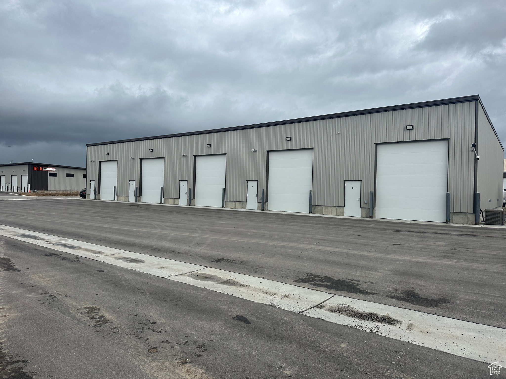 4 units of commercial/industrial space available for lease. Units A and B are currently a double unit but a dividing wall can be added. Units C and D are individual units. All 4 units could be opened up and rented out as one large unit if wanted. Each unit leases for $1,500 per month. Lessee pays rent, heat, gas and renters insurance. Lessor pays for water, taxes and insurance on building. Additional office space, walls etc. could be added for an additional cost. Private bathroom with open shop space. 12'x14' overhead door. Front of unit is 20' to ceiling and 18' towards the back of the unit. All Lessee's must be willing to sign Lessor's own lease agreement. Square footage figures are provided as a courtesy estimate only and were obtained from county records. Buyer is advised to obtain an independent measurement.