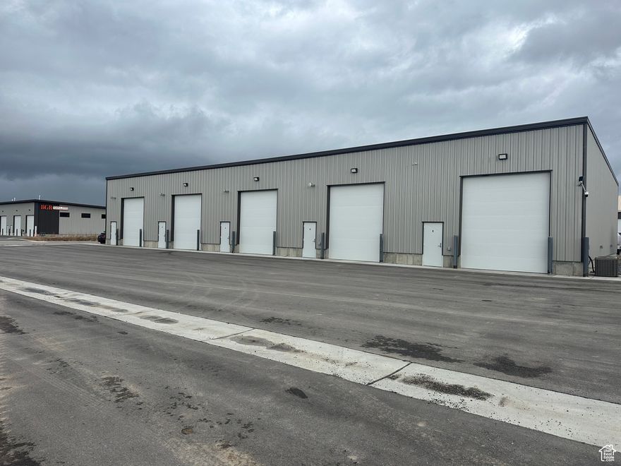 4 units of  commercial/industrial space available for lease. Units A and B are currently a double unit but a dividing wall can be added. Units C and D are individual units. All 4 units could be opened up and rented out as one large unit if wanted. Each unit leases for $1,500 per month. Lessee pays rent, heat, gas and renters insurance. Lessor pays for water, taxes and insurance on building. Additional office space, walls etc. could be added for an additional cost. Private bathroom with open shop space. 12'x14' overhead door. Front of unit is 20' to ceiling and 18' towards the back of the unit. All Lessee's must be willing to sign Lessor's own lease agreement. Square footage figures are provided as a courtesy estimate only and were obtained from county records. Buyer is advised to obtain an independent measurement.
