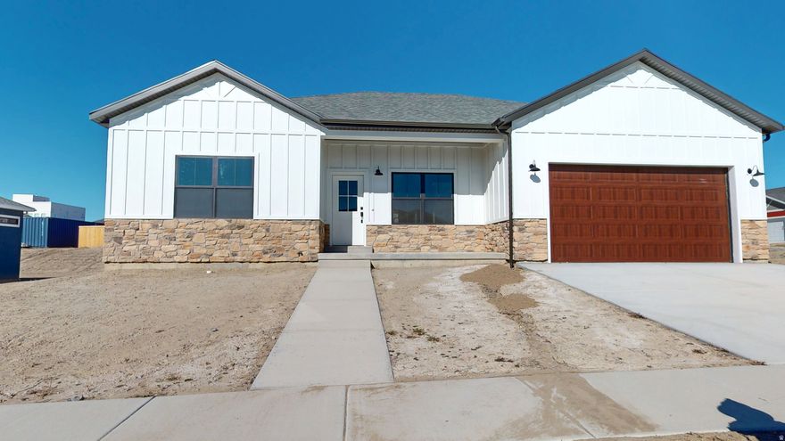 Discover this stunning new construction farmhouse-style home, complete with a full basement and modern design touches. Featuring three spacious bedrooms and two elegant bathrooms with double vanities, this home combines comfort and sophistication. Striking black fixtures add a bold, contemporary flair throughout. The chef's kitchen is equipped with top-of-the-line G.E. stainless steel appliances, Corian countertops, and a farmhouse sink. Thoughtful details include a pantry, closet organizers, and a dedicated cabinet for your wastebasket, keeping the space organized and clutter-free. The open layout flows seamlessly from the dining area and master suite to the back patio, perfect for outdoor entertaining or quiet relaxation. Additional features include a two-car garage, garage electrical outlets ready for electric vehicles, and prepped plumbing for a water softener, ensuring convenience and future readiness. This beautiful farmhouse effortlessly blends style, practicality, and comfort for modern living.