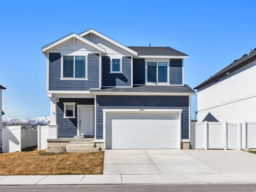 Welcome to this beautiful nearly new DR Horton home built in 2024, located in a growing and desirable neighborhood in Lehi. Offering 3,069 sq ft of living space, this thoughtfully designed home features 4 spacious bedrooms and 2.5 bathrooms, providing plenty of room for comfortable living and entertaining.  The open floor plan includes generous living areas filled with natural light and a well-appointed kitchen that flows seamlessly into the main living space. Upstairs you'll find spacious bedrooms and a functional layout ideal for families or guests.  Step outside to enjoy the fully landscaped yard, perfect for relaxing, entertaining, or enjoying Utah's beautiful seasons. The 2-car garage provides ample parking and storage.  Conveniently located just minutes from shopping, dining, and entertainment, including Costco Wholesale, along with numerous retail and dining options nearby. With easy access to major commuter routes and everything the area has to offer, this home combines modern construction, comfort, and an unbeatable location.  Don't miss the opportunity to own a like-new home in one of Lehi's fastest-growing communities.   Square footage figures are provided as a courtesy estimate only and were obtained from county.  Buyer is advised to obtain an independent measurement.