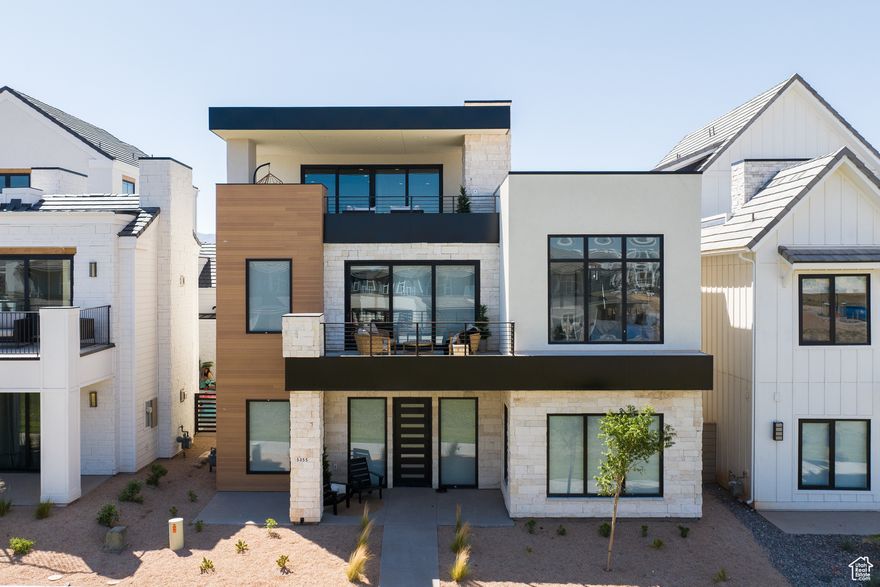 The innovative three-level modern concept is appointed at every turn with premium features including a Private Pool, a Gourmet Kitchen, 8 ensuite bedrooms including 2 separate massive Bunk Rooms with combined beds for 37+ people. Your friends and family will sprawl out across 3 separate Family Rooms, a spacious dining area, and a 440 sq. ft. Party Deck with panoramic views and a built-in fireplace. The home is elegantly placed on a beautiful grass park strip in the heart of Desert Color, southern Utah's master-planned vacation community. The activity options out your front door are virtually endless: Swim, kayak, or paddleboard in the clear blue Lagoon. Discover Walking and Biking trails traversing Tennis and Pickleball courts throughout the development. Explore the clubhouse wellness facilities, local shopping and dining, or take your swings at the Big Shots Golf Center. With Ember's innovative Co-Ownership model, you can own from 1/8th to 1/2 of this incredible asset for a fraction of the full purchase price. With interiors crafted by our award-winning design team, every Ember home experience comes fully furnished with worry-free property management and concierge service. The monthly operations contribution per 1/8th Owner is estimated at $883 (Includes Utilities, Maintenance, HOA, Reserve Fund Contribution, Property Tax, Management and Homeowner's Insurance). Square footage figures are provided as a courtesy estimate only and were obtained from Builder.  Buyer is advised to obtain an independent measurement.