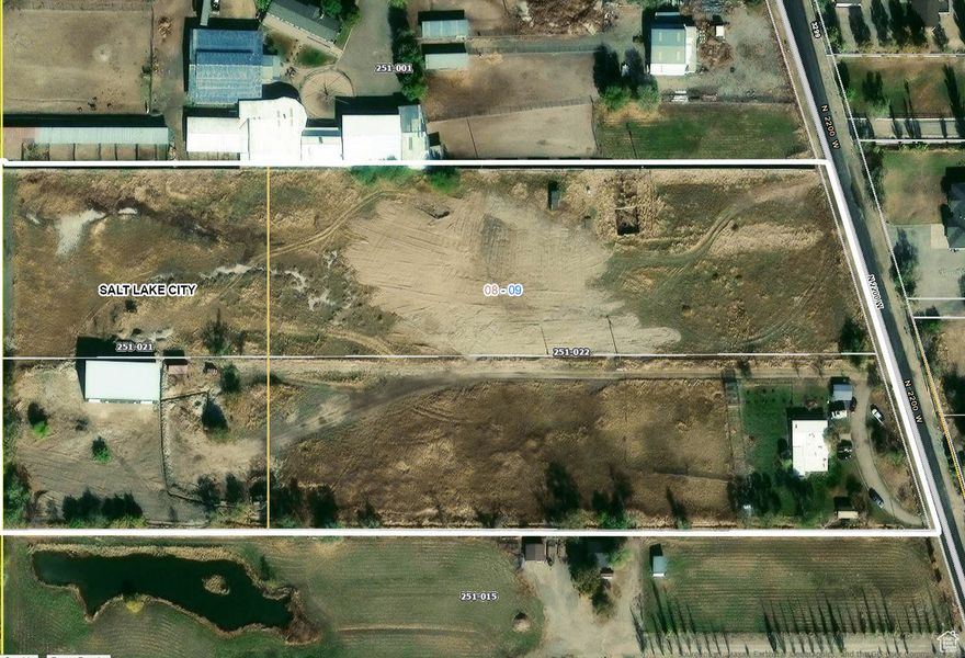 3215 N 2200 W Parcel #08092510030000 3253 N 2200 W Parcel  #08092510020000 Properties to be sold together. Total Acreage 10.13.  Home, detached 3200 Sq ft garage (less than 2 years old), and some sheds currently situated on the property. Recently Annexed into Salt Lake City as M-1A Light Industrial Zoning.   Contact agent to tour by appointment only.  Please do not bother tenant in the existing home. Tenancy through October 20, 2025.  Location Highlights:  -Direct access and proximity to I-215 and major freight corridors -Strategic proximity to both Salt Lake City & Davis County.  5 acre ft of Water Rights available with sale.