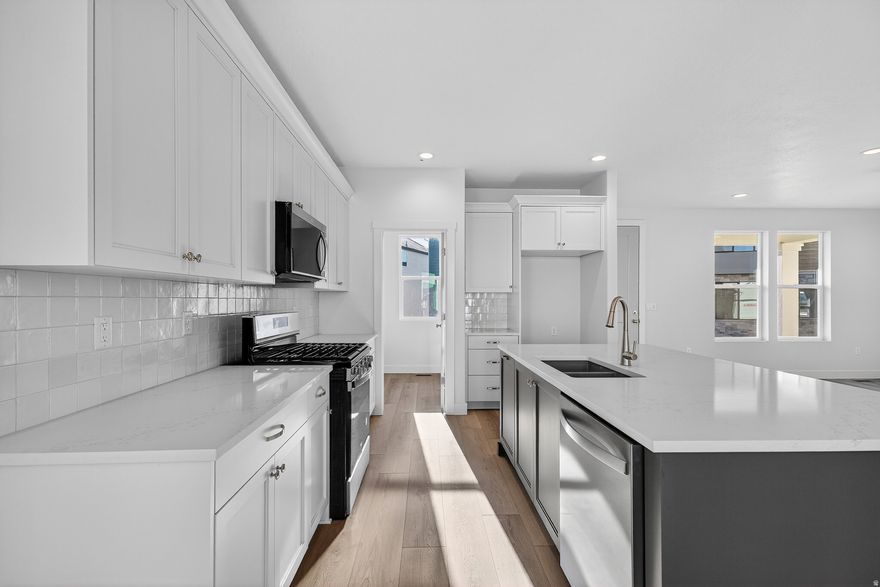 Farmhouse Vibes!!! Come fall in love with this brand new farmhouse 2 story. Truly move in ready with landscaping and fencing included. Walk from your front door to the first community park in under a minute and enjoy the incredible views of Ben Lomond peak while walking the trails in the community. Upgraded Features and quality throughout the home, highlights include a huge primary suite, oversized kitchen island and pantry, closets everywhere, and covered deck. More room for growth and storage in unfinished basement. Need help with closing costs or buying down your interest rate? Use one of our preferred lenders for amazing incentives and a no cost refinance for 3 years. Don't miss out. Landscaped photos are a representation, landscaping is not yet installed.