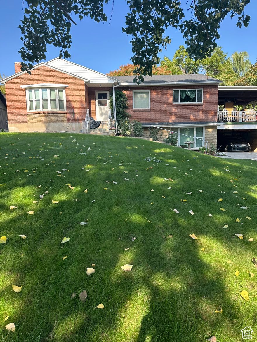 Location, Location, Location!  Home is located on a beautiful lot with a private backyard. Large coved deck ,plus a backyard patio   and a fireplace.  Interior features include a gas fireplace place,  2 bedrooms up and 2 baths. Also includes   a Basement apartment  with 2 bedrooms and a bath.