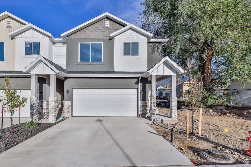 HURRY!! ONLY A HANDFUL LEFT!! EXCITING NEWS!!SELLER INCENTIVES OF $5K TOWARDS RATE BUY DOWN OR CLOSING COSTS! Contact Listing Agent for more information! Don't miss out on this beautiful two-story townhome in the heart of Tooele with high quality finishes and great curb appeal! These townhomes feature a Main floor open concept, 2 car attached garage, three bedrooms and 2 bathrooms upstairs and private yard. Basement is finished as a studio space with full bathroom and kitchenette with laundry hookups and lots of storage space. It includes an extra entrance through the garage for Basement access. GREAT FOR INVESTORS AS WELL AS THESE CAN BE YOUR NEXT RENTAL PROPERTY! POSSIBLE GRANT OPTIONS UTAH HOUSING 20K** Square footage provided as a courtesy only and was obtained from building plans. Buyer is advised to obtain independent measurement.