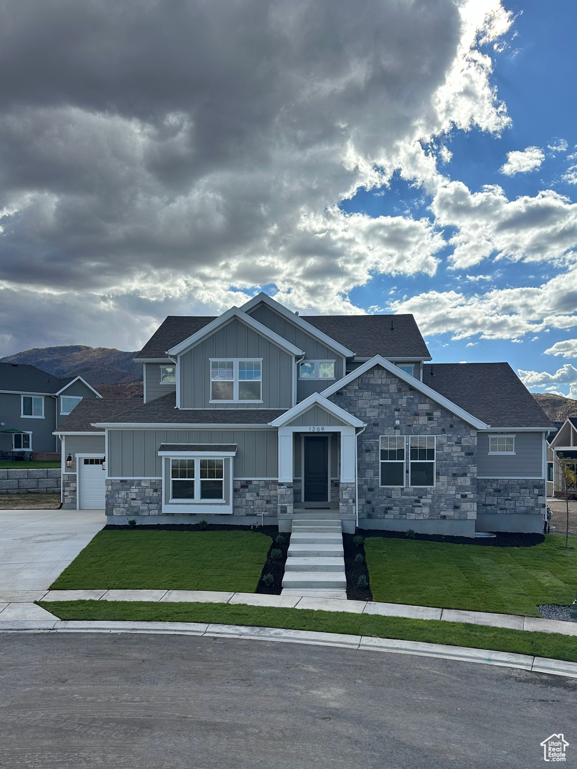 This beautiful master-on-main home is a true masterpiece, designed with both comfort and elegance in mind. As you step inside, you'll be greeted by a spacious, open-to-below family room, bathed in natural light from expansive windows. The room is anchored by a grand fireplace that stretches all the way to the ceiling, adding warmth and a touch of grandeur. A ceiling fan enhances airflow, adding to the sense of openness. The chef's kitchen is nothing short of spectacular, featuring sleek quartz countertops and top-of-the-line Z-Line appliances. A double cabinet panel fridge/freezer, large 6-burner range, and custom cabinet hood make this kitchen as functional as it is stylish. Whether you're cooking, entertaining, or enjoying family meals, there's ample space for it all. The private master suite is a serene retreat, offering a spacious bedroom and a luxurious spa-like bath. The master bath features a freestanding tub, custom tile shower, and a large double-sink vanity creating the perfect environment to relax and unwind. The master closet presents an attached private laundry room, with an additional laundry room located upstairs for added convenience. Every detail in this home has been thoughtfully designed to create a living space that's both beautiful and practical. The unfinished basement offers additional potential for customization, providing ample room for future growth.