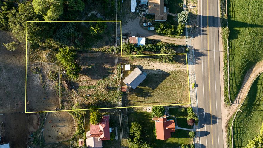 This adorable and renovated Park Model home sits on 0.66 acre on the charming Main Street of Glendale, UT. This property is zoned commercial, but is set up for residential living. Potential for Glamping Sites! Established RV site with full hookups behind the home. A great place for you and your animals, as horses are welcome! Or, utilize the flexibility of the Main Street, Commercial Zoning and make it something new! Mature fruit trees, and an irrigation water share give you ample options for this sweet parcel. Short term rentals allowed! Many investment possibilities await. (Buyer to verify all).