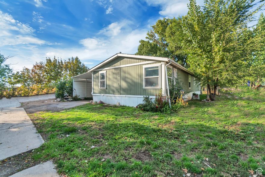 Spacious 4-Bedroom Home with Privacy and Updates! Nestled on a more private drive set apart from nearby homes, this well-maintained doublewide manufactured home offers both space and seclusion. Inside, you'll find 4 bedrooms and 2 full bathrooms, including a recently renovated primary bath designed for comfort and style. The main living areas feature beautiful hardwood floors that extend through the living room, dining room, and kitchen, creating a warm and inviting atmosphere. One bedroom and the office area boast newly updated laminate flooring, blending practicality with a fresh look. Additional upgrades include a recently replaced evaporative cooler, ensuring year-round comfort. This home is move-in ready and perfect for anyone looking for room to grow in a peaceful setting.   There has been some difficulty locating the home. This pin leads directly to the home.  https://maps.app.goo.gl/3vzP9qwViGyhG2B99   "All footage and measurements are deemed reliable but not guaranteed. Buyer is advised to obtain their own measurements and complete due-diligence to their satisfaction."