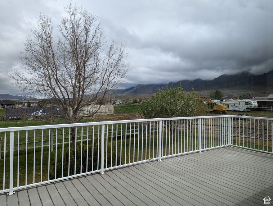 Gorgeous views! .7 acre lot with animal rights. Plenty of room for a shop, garden or animals. Great location. Large spacious floor plan. Room for additional bedrooms in the basement. Walk-out basement with kitchenette-could easily be ADU. Pool table stays! One half share of Mona Irrigation water is dedicated to this property. All figures per county records. Buyer to verify.