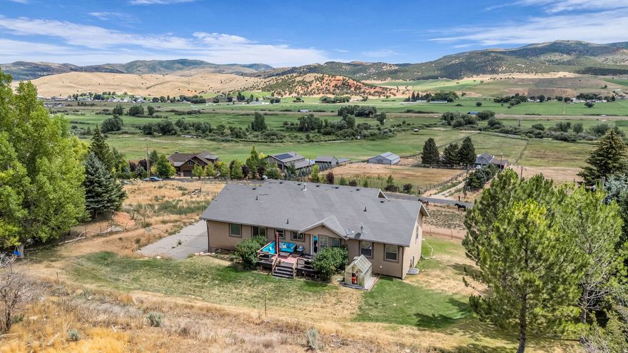 Don't miss out on this hidden gem nestled in the the hills of West Hoytville. This home and property stand tall above the valley of Coalville and Hoytsville with excellent views of the Weber River and the western slopes of the Uinta Mountains. With 5 acres, the sky is the limit with no HOA you can keep livestock and achieve the homestead dream. With an open floor plan this 5 bedroom and 3 baths and 2 different living rooms everyone can have their space. The home has been meticulously cared for and in excellent condition. Only moments away from downtown Coalville and 25 minutes from Park City and world Class ski resorts. The valley is hemmed in by Echo and Rockport Reservoir which adds plenty of opportunity for water sports. Don't miss out on this opportunity!