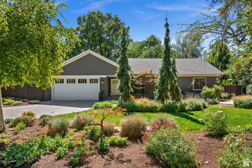 Nestled in one of Millcreek's most coveted neighborhoods, this estate rests on a rare lot where the Millcreek stream runs the full length of the backyard. The setting is a true private oasis-anchored by a majestic weeping willow and enhanced by the soothing sound of flowing water.  Designed for effortless single-level living, the home features four sunlit bedrooms, two bathrooms, and a spacious open-concept kitchen and living area that seamlessly extends outdoors. A pitched roofline with skylights brings volume and natural light to the living room, creating a warm and airy atmosphere.  The lower level offers a comfortable family room, plus an oversized laundry and storage area for added convenience. A unique blend of modern comfort, timeless charm, and natural serenity.  Fully renovated in 2023, the home includes a modern kitchen with new appliances and custom cabinetry, updated bathrooms, new flooring throughout, and all-new systems-plumbing, electrical, HVAC, insulation, roof, and solar panels.  Additional highlights include an attached two-car garage, heated driveway, a beautifully landscaped yard with mature plantings encircling the property, an oversized shed and an outdoor sauna.  All this in an unbeatable Millcreek location-just 15 minutes to downtown Salt Lake City and the International Airport.   Square footage figures are provided as a courtesy estimate only.  Buyer is advised to obtain an independent measurement.