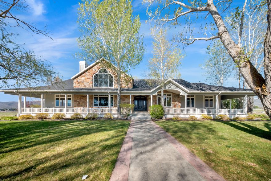 Can be SOLD with additional 13 ACRES. Tucked away on 9 incredibly private acres with no neighbors in sight, this one-of-a-kind estate is the ultimate retreat for gathering, entertaining, and making lifelong memories. Spend summer nights relaxing by the heated in-ground pool while enjoying the peaceful surroundings and wide-open views. Inside, you'll find expansive family gathering spaces designed for hosting on any scale, along with countless fun areas for kids and grandkids to explore and enjoy. The gorgeous formal living room/library on the main level is an absolute showstopper, offering warmth, character, and the perfect space to relax or entertain. The indoor half-court basketball court adds a rare and exciting feature that makes this property truly unforgettable. The property also includes a detached ADU featuring a two-bedroom apartment, multiple detached garages, a large barn, and exceptional parking accommodations with space for over 25 vehicles and indoor parking for 13+ cars. Located on desirable flat ground, this incredible property offers privacy, versatility, and endless opportunities to make it your own.