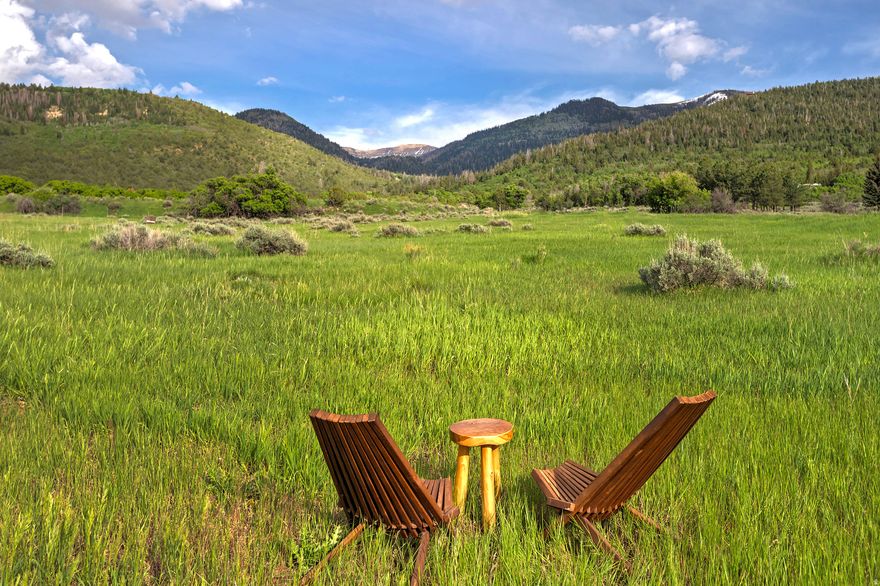 Discover this stunning 19.91-acre building lot, perfectly situated to take advantage of breathtaking views and endless possibilities. Approved for a one-lot major subdivision, this property is ready for your dream home or investment project. This lot features a pre-drilled well, complete with 1.2 acre-feet of water rights for culinary or irrigation use, ensuring you have all the resources you need. Enjoy year-round access via a paved road, with power already stubbed and ready for your convenience. Additionally, the property includes a spacious garage, providing ample storage for your equipment or vehicles. Don't miss out on this exceptional opportunity to own a piece of paradise with both practicality and potential. Act now to make this remarkable lot yours!