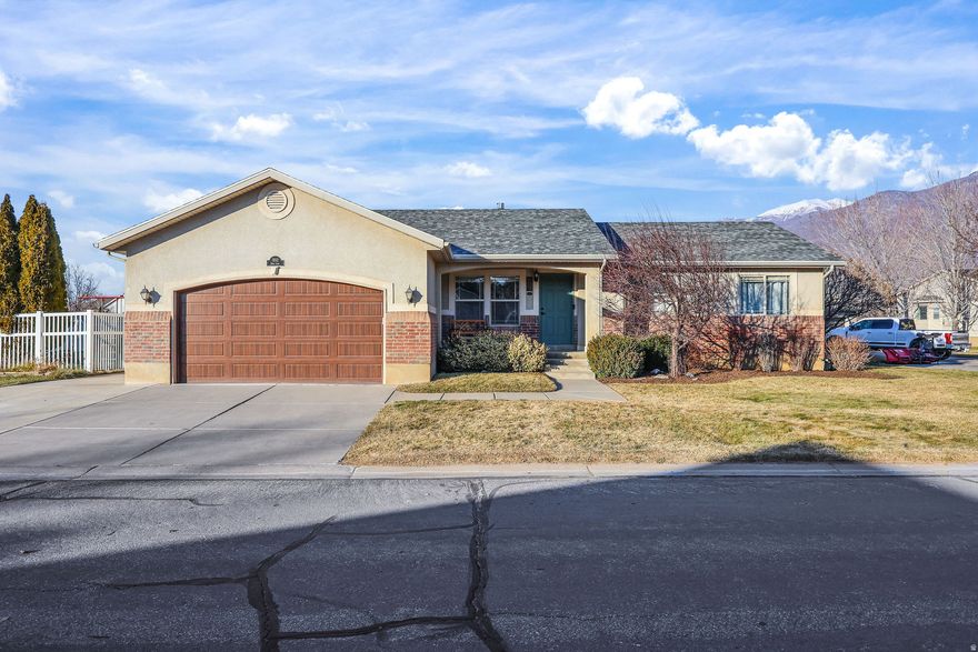 Enjoy mountain views and a well-cared-for home with major updates already completed, including a new roof (2026), new garage door, and permanent holiday lighting. The functional layout offers two laundry rooms for added convenience and flexibility. Ideally located with easy access to I-15 and Hwy 89, making commuting simple while keeping you close to the mountains, skiing, hiking, and outdoor recreation. No backyard neighbors, fenced yard and a new large shed.  A great opportunity to own a home that blends comfort, location, and lifestyle.