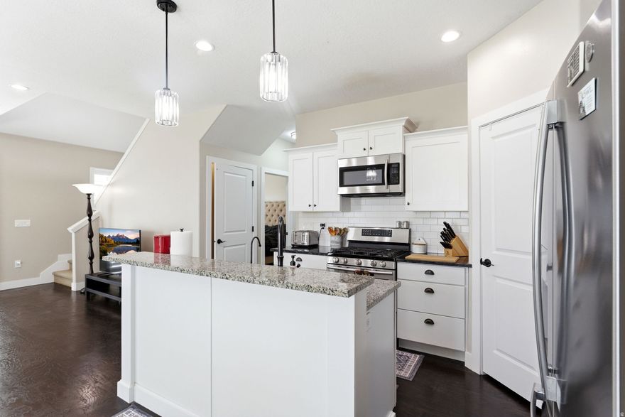 **OPEN HOUSE SATURDAY APRIL 25, 2026 1-3PM**  Beautiful former model home in desirable Cedar Hollow Townhomes! This upgraded  townhome offers 4 bedrooms, 4 bathrooms, and plenty of space for gathering. The open layout features 100% granite countertops throughout, vaulted ceilings, and abundant natural light plus newly installed updated LED lighting and fans in the home. The kitchen and living areas flow seamlessly, perfect for both everyday living and entertaining.  Upstairs bedrooms include spacious closets, with a charming built-in window seat in the primary suite. Enjoy modern upgrades such as a tankless water heater, smart thermostat (Nest), and energy-efficient LED lighting throughout. Quiet, direct-drive ceiling fans and extended-height toilets with soft-close seats add comfort and convenience.  New water softener system by Kinetico.  Newly installed high efficiency  furnace and air conditioning.  Step outside to a private backyard with a beautiful Trex-deck-ideal for relaxing or hosting gatherings. Located on a corner lot with mountain views, this home also includes a 2-car garage and access to community amenities including a playground, picnic area, and maintained common spaces.   Conveniently located near schools, shopping, and commuter routes. HOA covers water, sewer, trash, and snow removal. Don't miss this move-in-ready home loaded with upgrades!  Buyer and Buyer agent to verify all information all though deemed reliable.