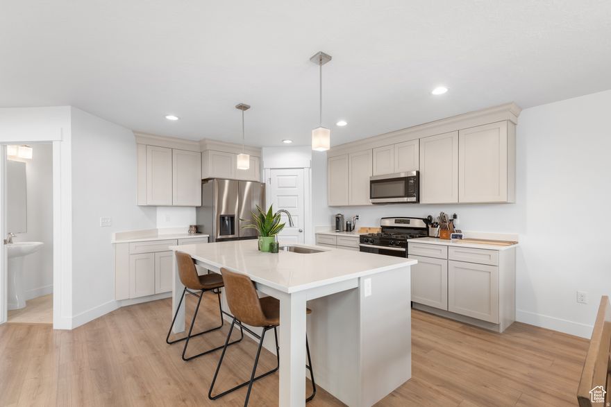 MOTIVATED SELLER! Seller is offering a 1/0 rate buydown with preferred lender! Get a rate of 5.231% for the first year!  Clean, bright, and beautifully simple, this Herriman two-story home offers unobstructed views you won't find in most west-side homes. With a clear shot of the Kennecott Copper Mine and open space behind the property, the privacy and scenery here are truly standout features. Inside, over 2,800 sq ft of thoughtfully designed space includes an open layout, soaring ceilings, and large windows that fill the home with natural light. The kitchen features quartz countertops, an oversized island, and timeless cabinetry, along with a spacious dining area perfect for everyday living or hosting. Upstairs, the generous primary suite includes a walk-in closet and double-sink bath, with two additional bedrooms and a full bathroom just down the hall. Step outside to a raised deck overlooking permanent open space-ideal for quiet mornings, sunset views, or effortless entertaining. The fully fenced yard, two-car garage, and unfinished basement with room to grow make this home as functional as it is inviting. With move-in-ready comfort, priceless views, and no future development behind you, this is the kind of property buyers wait for in Herriman.