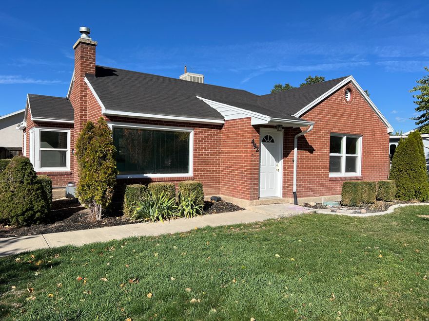 Discover timeless elegance in this renovated 1941 all-brick charmer on a spacious corner lot in the heart of Orem! Meticulously updated for modern living, this move-in-ready gem boasts a brand-new forced air HVAC system with central air, updated electrical, fresh paint, new carpet, new granite countertops, refinished cabinets, and new appliances. Bask in the natural light pouring through large windows, cozy up by the gas fireplace, and enjoy the peaceful ambiance that welcomes you home. Outside, a fully fenced large yard with patio invites relaxation or gatherings, while the newer roof and windows ensures worry-free ownership. Nestled in a friendly neighborhood near UVU, schools, shopping, and amenities, this inviting haven blends vintage character with contemporary comfort-don't miss your chance to make it yours!