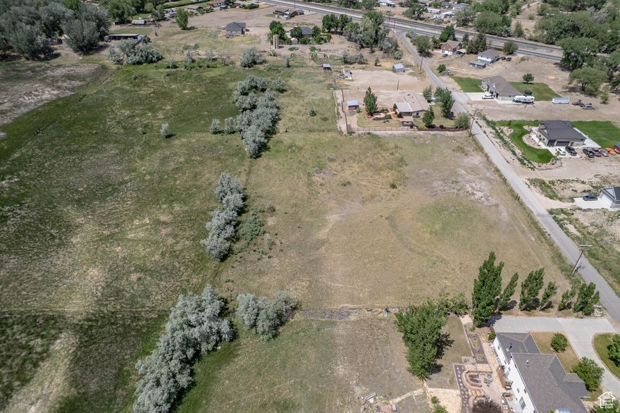 Build Your Dream or Invest in the Future! Don't miss this exceptional 2.15-acre building lot located just minutes from Price. This property is uniquely positioned for both immediate use and future potential; while currently a peaceful setting for a custom home or hobby farm, its proximity to commercially zoned property may open the door for a future re-zone. The lot is build-ready with PRWID sewer and utilities already on-site. Per Carbon County records, the land is located outside of flood zones/flood ways. Bring your horses and enjoy the mountain views, or capitalize on the location's growth potential. Buyer to verify all zoning possibilities and requirements with Carbon County planning and zoning    Square footage figures are provided as a courtesy estimate only and were obtained from _County Records .  Buyer is advised to obtain an independent measurement.Buyer to verify all zoning possibilities and requirements with Carbon County planning and zoning