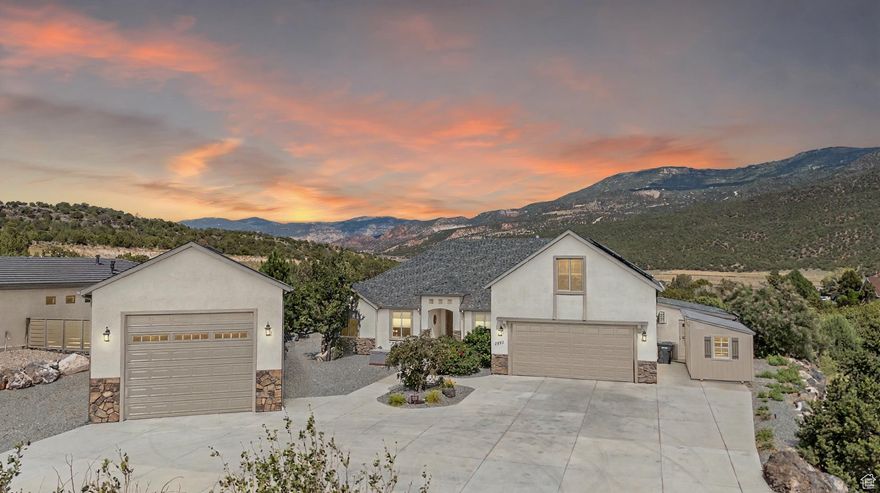 **Reduced $60,000!** Top of the hill views, gorgeous outdoor living space, detached RV garage, solar panels -this home has it all - but NO HOA! One of the best locations and neighborhoods, this beautiful home is quite literally on a hill overlooking the South Mountain area & Shurtz Canyon. It has a 3/4 enclosed back patio that is protected from the elements doubling as an outdoor living & entertaining area overlooking views, garden, firepit, & waterfall. Most space is on the main level with only 532 sq ft up; this space while being two bedrooms & bathroom would also function great as an upstairs master suite, office suite or studio w/its wall of built- in storage. The other exceptional feature is the 700 sq ft detached RV garage, which is fully insulated, w/wall heaters, 220 power, built-in storage & workshop.