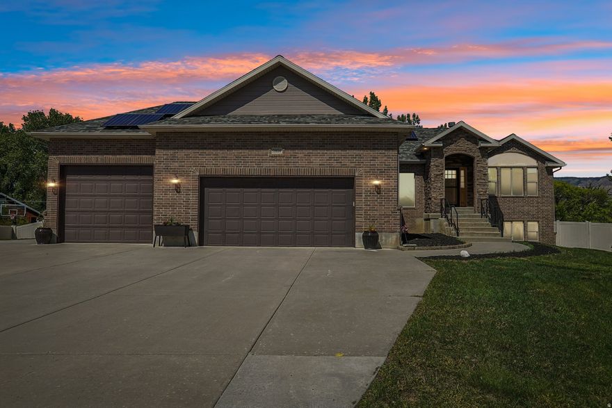 Mountain Views, Paid Solar & Room To Breathe Welcome to a home that offers the perfect blend of comfort, space, and peaceful country living. Set on a large fenced yard with stunning mountain views, this inviting rambler gives you room to spread out, entertain, garden, and truly enjoy the lifestyle so many buyers are searching for.  Inside, you'll find a warm and welcoming layout with spacious living areas designed for gathering and everyday living. Large windows bring in natural light while showcasing the surrounding scenery. The walk-out basement adds incredible flexibility with its own mini kitchen-ideal for multi-generational living, guests, entertaining, or the perfect hangout space. Step outside and enjoy the beautifully usable yard complete with gardening areas, space to play, relax, host summer BBQs, or simply take in the peaceful surroundings. Paid-for solar panels help add efficiency and long-term value while keeping utility costs lower. With a 3-car garage, generous square footage, scenic surroundings, and a location that offers both privacy and convenience, this is the kind of property buyers wait for. Come experience the warmth, views, and space for yourself. Schedule your private showing today!