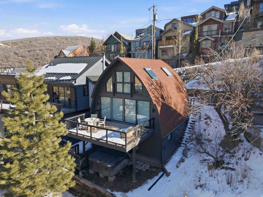 421 Ontario Ave in Park City is a beautifully remodeled home, updated in 2023, offering the perfect blend of modern living and Old Town charm. This two-bedroom, three-bathroom home is bathed in natural light, thanks to large windows that showcase incredible views of Park City and Old Town. The open-concept living area features a cozy gas-burning fireplace, creating a welcoming atmosphere. The sleek kitchen is ideal for both everyday meals and entertaining. With three thoughtfully designed bathrooms, the home provides ample space for comfort and convenience. Enjoy the outdoors from two spacious decks, or relax in the hot tub, a perfect spot to unwind after a day of skiing or exploring. The property comes fully furnished and includes two uncovered parking spots right out front. Just a short distance to Main Street, you'll be able to easily access the best dining, shopping, and nightlife Park City has to offer, making this the perfect base for enjoying all that this vibrant town provides.