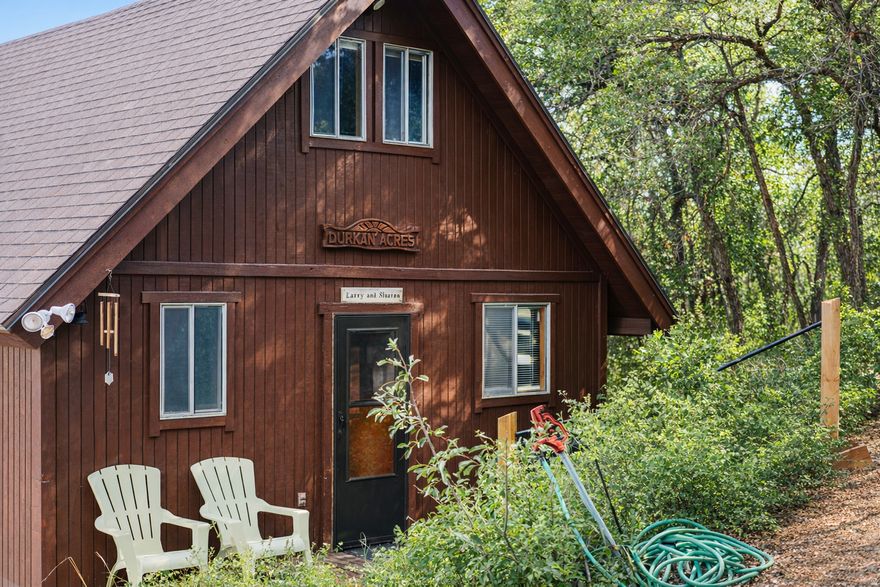 PRICE REDUCED! Secluded Mountain A-Frame Getaway or Guest House! Fully furnished and turn-key! Only 930 sq ft and waiting for you to build your main dream home on this spacious parcel. Enjoy the fantastic mountain views and its open floor plan-you must see it to appreciate the ambiance and setting. Designed for modern rustic tastes, with open areas and plenty of windows and light. One large, unconventional bedroom in the loft could easily become two bedrooms. This parcel covers over 2 acres and is lushly surrounded by gorgeous tall Oak trees and abundant wildlife you can enjoy from your new trex deck. You can explore this magical parcel with your ATV's that are included in the Sale, 1 Polaris and 2 Yamahas.