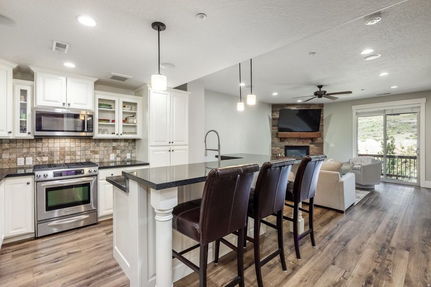 Live large with pool, hot tub, fitness center, clubhouse, picnic tables, dog park and walking/bike path included as part of your $390/month HOA dues or hop on the adjacent trail system for access to all Park City offers. Want to rent out the property when you are not using it? No problem! This stylish 3-bedroom, 3-bath townhome is designed for effortless mountain living. The open floor plan, updated with hardwood flooring and a new roof, flows seamlessly from the gourmet kitchen-featuring granite countertops and stainless appliances-to the sunlit living spaces. The spacious primary suite includes a flex room, ideal for a home office, gym, or nursery. A full-length driveway and 2-car garage offer rare convenience. Enjoy the fresh mountain air from your patio or deck. Walk to the Overlook Restaurant & Bar or drive 5 minutes to Jordanelle State Park and Deer Valley East Village via the Jordanelle Parkway. Whether you're seeking a full-time residence or vacation retreat, low-maintenance and fully furnished townhome delivers the best of Park City living. There is only one stoplight to Kimball Junction and the Salt Lake International airport!