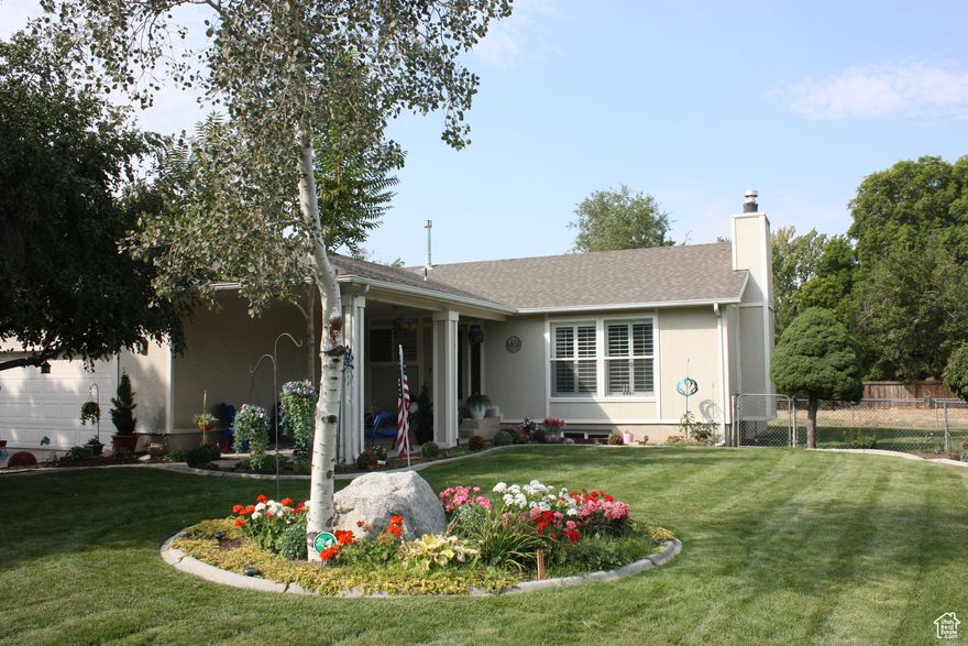 What a present this would be. Move in this gem by Christmas! NEW LOW PRICE! Interest is lower and so is the price of this home! COME SEE this charming rambler in fantastic Sandy location. New basement kitchen, great for mother in law or additional family. Large storage room. Beautifully  landscaped with private backyard.  Large front covered porch to enjoy your evenings. Side patio has fire pit and gazebo. Yard is fenced and has garden boxes. Tons of garage storage.  Don't miss this one!  *seller offering $8000.00 in concessions*