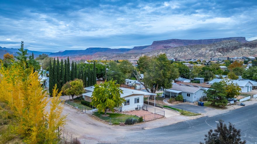 This 2-bedroom, 2-bath, storage room in the basement, modular home sits in the heart of La Verkin with classic hillside views and easy access to parks, shops, dining, Hurricane City, and Zion National Park. The home is being sold as-is and does need minor repairs, but it's fully livable and offers solid potential for a first-time buyer, down-sizer, or investor. With an open layout, on-site parking, city utilities, and a level parcel that captures those signature La Verkin hillside views, this property delivers affordability, convenience, and long-term upside in one of Southern Utah's most sought-after gateway towns.