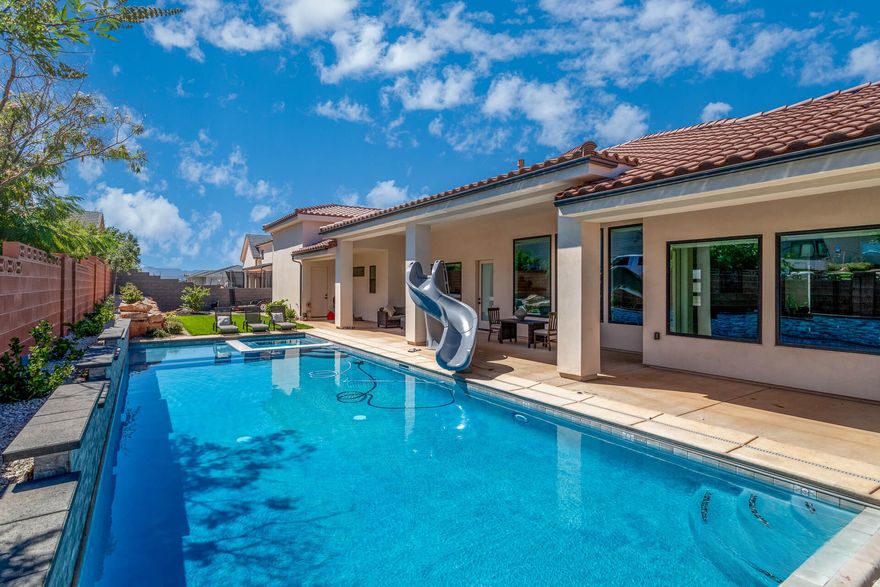 Entertain in Style in Your Santa Fe Retreat! This gorgeous white stucco home is an entertainer's paradise, both indoors and out. The gourmet chef's kitchen is a showstopper, featuring a crisp white aesthetic accented by glamorous gold finishes and a butler's pantry - perfect for seamless entertaining. Outside, a sparkling saltwater pool and expansive patio area are perfect for hosting memorable gatherings. Guests will appreciate the comfort of two private guest suites. Plus, enjoy the massive benefits of having an extra-large garage and RV parking for all your toys.