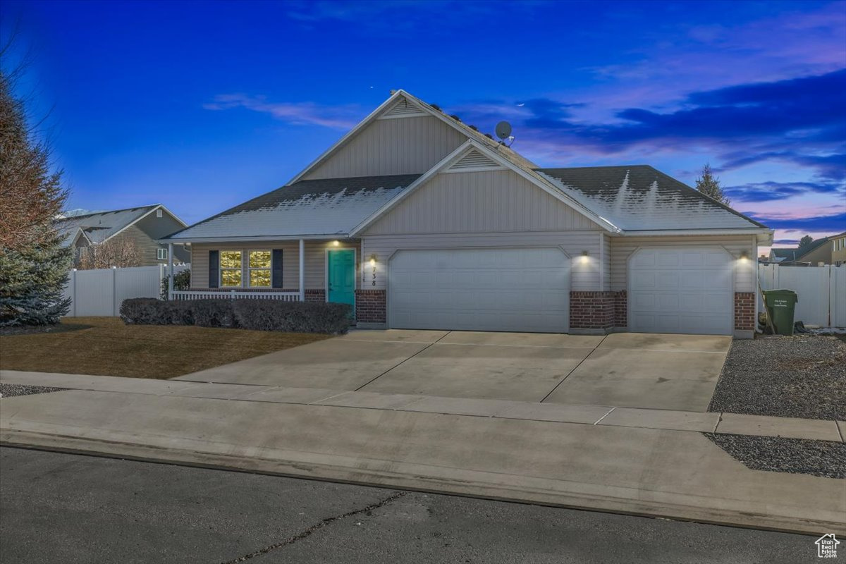 Charming single level living home with 3 car garage in Nibley UT, minutes from Logan and USU.  Nestled on a spacious .28-acre lot, this delightful 3-bedroom, 2 bath home offers the perfect blend of comfort and functionality.  The property boasts a serene setting with ample yard space or outdoor activities, gardening or simply relaxing on the patio, enjoying the mountain views, with the retractable awning and calming recirculating water feature.  Inside you will find a thoughtfully designed layout, highlighted by an inviting owner's suite complete with a private bathroom, ensuring your own personal retreat.  Two additional bedrooms and a shared bathroom make this home ideal for families, guests or creating a home office.  Home has been updated with LVP flooring, a new water heater which was replaced in 2024, range and refrigerator are brand-new, 2 car garage door has recently been replaced along with the hardware on the cabinetry and dishwasher was replaced in 2023.  It is conveniently located between two parks, close to schools and amenities, within an hour from 2 ski resorts, Cherry Peak and Beaver Mountain, and the beautiful  Bear Lake ( the Caribbean of the west).  Bonus: chicken coop is included with the sale of the home.  You won't want to miss out on this rare find for a single level living home without an HOA.