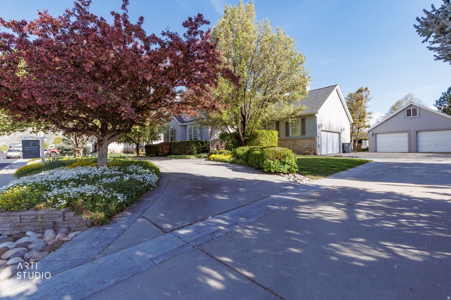 *** No showings until the open house Saturday from 2:30-4:30 *** Welcome to this beautifully maintained, one-owner custom home in Mapleton, thoughtfully designed with space, light, and flexibility in mind. Nestled on a quiet street in a peaceful setting, this home offers 6 bedrooms with the option for a 7th, as the expansive primary suite can easily be reconfigured to meet your needs. From the moment you enter, you'll appreciate the vaulted ceilings, abundant natural light, and inviting layout that creates both comfort and functionality. The home has been exceptionally well cared for, with mature trees and a beautifully maintained yard that enhance the sense of privacy and tranquility. Step outside to a large back deck perfectly positioned to take in stunning mountain views, creating an ideal space for relaxing or entertaining. Car enthusiasts, hobbyists, or those needing extra space will love the oversized detached garage featuring a workshop and loft, in addition to four indoor garage parking spaces. This home offers a rare combination of space, flexibility, and peaceful surroundings, all in one of Mapleton's most desirable areas.  This home invites you to truly settle in, grow, and enjoy the beauty it offers.