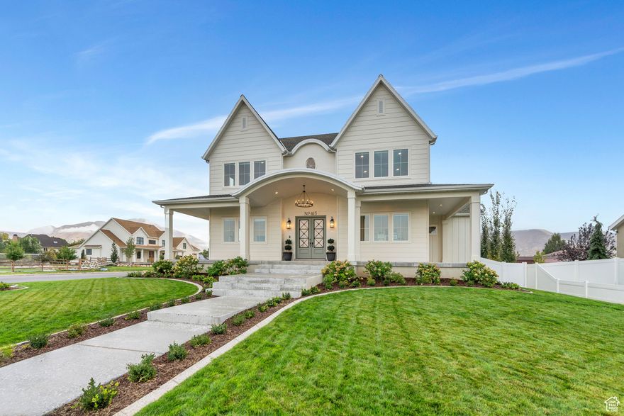 Welcome to this stunning custom-built home, completed in 2023 and set on .7 acres in the heart of Mapleton. Designed with an open floor plan, 10-foot ceilings, and a 20-foot great room, this home feels bright, spacious, and inviting. The kitchen is built for both everyday living and entertaining, featuring quarts countertops, a 48-inch Italian Ilve gas range, dual Bosch dishwashers, and a large butler's pantry with room for an extra oven or fridge. The bathrooms boast of beautiful finishes that include granite & marble countertops. A bonus studio space with its own entrance is prepped for a full kitchen-great for guests, an office, or a rental. The walkout basement has tall ceilings, finished framing, and ductwork, ready for your final touch. Bring your animals-chickens, horses, goats, and pigs are all allowed (just no cows). This property offers the best of modern comfort and country living in one of Mapleton's most peaceful settings.  (The Studio Space currently gets an average of $1,850 per month with additional income if used for events.)