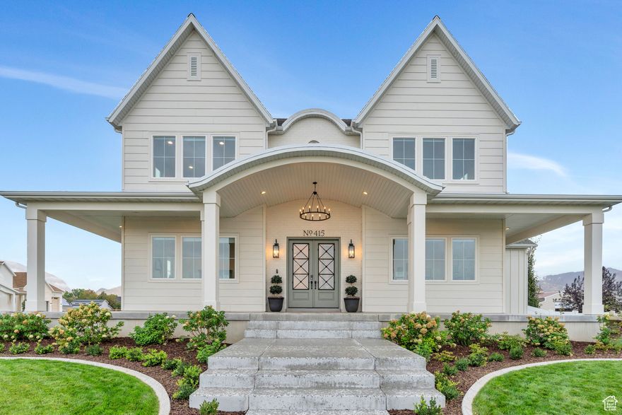 Welcome to this stunning custom-built home, completed in 2023 and set on .7 acres in the heart of Mapleton. Designed with an open floor plan, 10-foot ceilings, and a 20-foot great room, this home feels bright, spacious, and inviting. The kitchen is built for both everyday living and entertaining, featuring quarts countertops, a 48-inch Italian Ilve gas range, dual Bosch dishwashers, and a large butler's pantry with room for an extra oven or fridge. The bathrooms boast of beautiful finishes that include granite & marble countertops. A bonus studio space with its own entrance is prepped for a full kitchen-great for guests, an office, or a rental. The walkout basement has tall ceilings, finished framing, and ductwork, ready for your final touch. Bring your animals-chickens, horses, goats, and pigs are all allowed (just no cows). This property offers the best of modern comfort and country living in one of Mapleton's most peaceful settings.  (The Studio Space currently gets an average of $1,850 per month with additional income if used for events.)